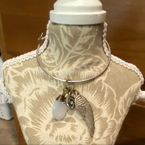 Silver bangle with charms